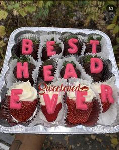 a tray filled with chocolate covered strawberries and the words best head ever