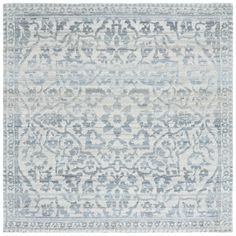 a blue and white rug with an ornate design