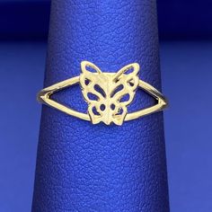 Be unique with this exquisite solid 10k yellow gold butterfly ring. Its minimalist design features wings that elegantly stick out, making it an eye-catching addition to any outfit. Make a statement with this beautiful and stylish ring. Metal: 10k Gold Type: Ring Size: 6 We size up to two sizes free of charge. Please contact us for pricing on resizing more than two sizes. We need 2-3 business days to resize this ring. We do not accept returns on resized and/or altered rings. We guarantee all mate Gold 14k Butterfly Shaped Ring, Gold Butterfly Ring In Fine Jewelry Style, Gold 14k Butterfly Ring, Gold Open Butterfly Ring In 14k Gold, Adjustable Elegant Rings With Butterfly Charm, 14k Gold Butterfly Ring For Anniversary, Yellow Gold Butterfly Ring For Formal Occasions, Formal Yellow Gold Butterfly-shaped Ring, Formal Yellow Gold Butterfly Ring