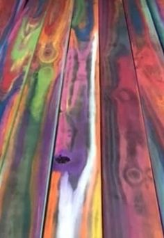 an image of multicolored wooden planks that look like they have been painted