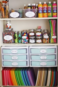 the shelves are filled with craft supplies and storage bins for storing items such as markers, pencils, pens, paper