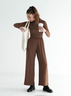 The Hana Jumpsuit is the ultimate done-in-one outfit. With its compressive bodice, high wasted culotte pant, and deep side seam pockets, it’s designed to be effortlessly elegant while simultaneously maximizing your comfort level. Wear it as is to a dance class, or to walk to the park. Or layer it with your favorite little cardigan and a hat to head out for the day. And its versatility doesn’t stop there — you can rock it with your favorite comfy heels for a night out. We aren’t exaggerating when Wide Leg Stretch Jumpsuits And Rompers For Loungewear, Stretch Wide Leg Jumpsuits For Loungewear, Wide Leg Stretch Jumpsuits And Rompers In Solid Color, Stretch Wide Leg Jumpsuits And Rompers In Solid Color, Stretch Solid Color Wide Leg Jumpsuits And Rompers, Solid Stretch High-waisted Jumpsuits And Rompers, Solid Color Wide Leg Jumpsuits And Rompers For Loungewear, Solid Color Wide Leg Jumpsuits For Loungewear, Wide Leg Loungewear Jumpsuit