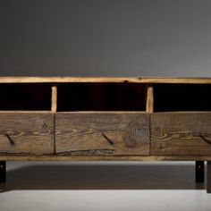 an old wooden cabinet with three drawers