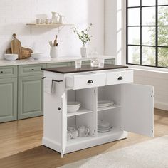 a white kitchen island with two open shelves