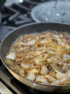 onions are cooking in a pan on the stove