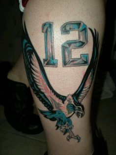 an eagle with the number twelve on it's leg is shown in this tattoo