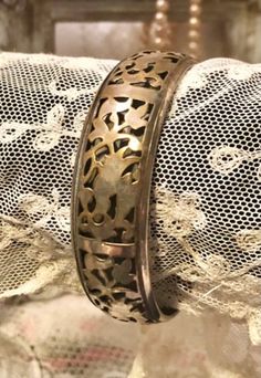 "Intricate Metalwork~Filigree Bangle Bracelet ~Vintage well made Silver over Brass Bangle Bracelet 2 layers of metal , filigree or pierced design layer over a solid layer Approximately 3/4\" wide Approximately 2 5/8\" opening ... I imagine this used to be more silver and has wore to silver with lots of brass showing through... I love the look ! pretty & different! This could be polished if you desire a bright shiny mixed metal look.. The patina on this piece really adds to its appeal to me ... s Filigree Bangle, Antique Filigree, Lampwork Earring, Brass Bangle, Handmade Pins, Brass Bracelet, Bracelet Vintage, Metal Work, Silver Filigree