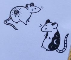 a mouse and a rat sitting next to each other on top of a piece of paper