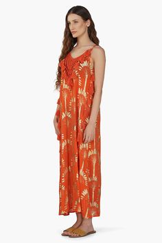 Palm foil print Maxi Dress with Spaghetti Straps Crochet Patch at Neck Cotton Tassel Detail at neckline and sides Princess A-Line Shaped Maxi Dress The Sunset Palm Foil Tassel Maxi Dress is a stunning and radiant piece that captures the essence of summer in every detail. Crafted from palm foil print fabric, this maxi dress embodies tropical elegance with its vibrant design and flowing silhouette. Featuring spaghetti straps, this dress offers a delicate and feminine look that is perfect for warm Foil Print Fabric, Leopard Bag, Vibrant Design, Feminine Look, Bag Dress, Foil Print, The Sunset, Hand Beading, Printed Maxi Dress