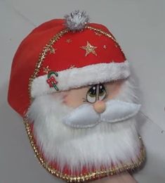 a santa clause hat with gold sequins on it