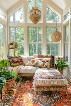 a sun room with large windows and lots of plants