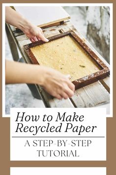 a person is holding an old wooden frame with the words how to make recycled paper on it