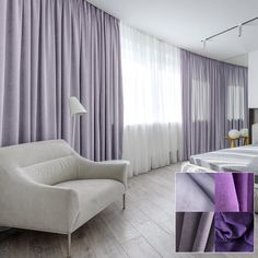 a white chair sitting next to a bed in a room with purple drapes on the windows