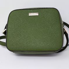 Streamlined And Simple, This Versatile Olive Green Kate Spade Cross-Hatched Saffiano Leather Cammie Crossbody Bag Is A Go-Anywhere, Take-Everywhere Essential. Whether You Pair It With A Printed Day Dress Or Jeans And A Tee, It Adds A Dose Of Classic Practicality. Part Of The Kate Spade Newbury Lane Collection. Front Gold Kate Spade New York Signature Plate 7.5" W X 7"H X 2"D Double Direction Gold Zippered Closure Adjustable Crossbody Strap 22" Drop Lined. Interior Zip And Slip Pocket Pristine Nw Classic Kate Spade Green Shoulder Bag, Classic Green Kate Spade Shoulder Bag, Kate Spade Green Office Bag, Green Kate Spade Office Bag, Kate Spade Green Crossbody Shoulder Bag, Kate Spade Green Bag With Adjustable Strap, Green Kate Spade Bag With Adjustable Strap, Formal Green Kate Spade Bag, Olive Green Color