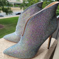 Iridescent Rhinestone Silver High Heel Ankle Boots, Size 7.5 M, Nib. Fabulous Boots Are Silvery Pewter Textured Metallic Fabric Covered With Iridescent Aurora Borealis Faux Crystal Rhinestones. Slip On Style Boots Have Raised Back And 4.5 Inch Heels Made For That Dress Up Affair Or Fall Holidays Party. Never Worn. Need A Good Shoe Lovers Home! Silver Bedazzled Boots With Pointed Toe, Silver Bedazzled Pointed Toe Boots, Silver Bedazzled Heels With Round Toe, Silver Bedazzled Round Toe Heels, Silver Ankle-high Rhinestone Boots, Silver Rhinestone Ankle-high Boots, Square Toe Leather Boots, Silver High Heel, Roper Cowboy Boots