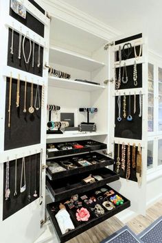 an organized closet with necklaces and jewelry