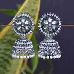 Perfect with ethnic & traditional wear. Fancy Party Wear Traditional Jhumki Earrings. Perfect gift for any occasion for yourself and your dear ones. It is advisable to store jewellery in a zip lock pouch (air tight pouch), keep away from water perfume and other chemicals and clean it with dry and soft cloth. Oxidized Finish Dangle Earrings For Wedding, Heavy White Fusion Style Jhumkas, Bollywood Style Oxidized Earrings For Wedding, Heavy Fusion Dangle Jhumkas, Silver Bollywood Jhumkas With Matching Earrings, Oxidized Earrings For Wedding And Festivals, Festive Oxidized Chandelier Earrings For Wedding, Festive Oxidized Finish Chandelier Earrings For Wedding, Silver Bollywood Ceremonial Earrings