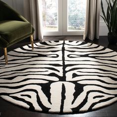 a black and white zebra print rug in front of a window