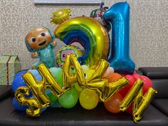 balloons and heliums are arranged in the shape of letters that spell out'i love you '