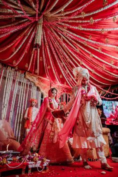 the bride and groom are getting ready to walk down the aisle