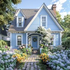 a blue house with lots of flowers and bushes around it's front door is shown in this artist's rendering