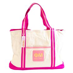 Say goodbye to boring totes and hello to the Weekender Sorority Tote! Perfect for weekend trips and everyday use, this tote features a spacious interior, convenient front pocket, and luxurious leather details. With a gold zipper and gold foil letters, this tote will add a touch of glam to your style. Dimensions: 25.5"L x 16"H x 6"D 12" Handle Drop Front Pocket 9.5" x 8" Sorority Swag Bag, Tri Delta Tote Bag, Alpha Chi Omega Tote Bag, Kappa Delta Tote, Sorority Bags Totes, Greek Gifts, Wedding Gifts For Bride, Sorority Gifts, Weekender Tote