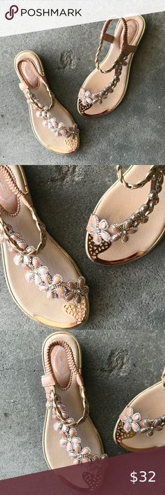 BEST SELLER Italina Floral Rhinestone Flat Sandal Italina Peach Floral Rhinestone embellished elastic slingback flatform sandal  This thong sandal is great to dress up, or dress down; day to night The soft elastic slingback keeps your foot secure & comfortable This sandal is embellished w/ neutral flowers, silver rhinestones, a gold plated design at inner toes & a gold braid. The insole is purposefully brushed w/ metallic gold strokes. All materials are faux leather & this sandal runs true to si Neutral Flowers, Dress Down Day, Low Wedge Sandals, Rhinestone Flats, Vegan Boots, Black Cow, Rhinestone Sandals, Flatform Sandals, Embellished Sandals