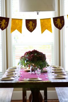 the table is set with plates and place settings for two people to sit at it