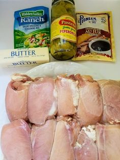 raw chicken and other ingredients laid out on a counter