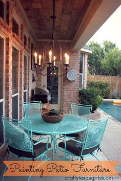 an outdoor dining table and chairs on a patio