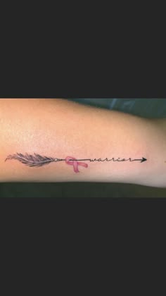 a woman's arm with an arrow and the word love written in cursive writing