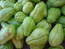 a pile of green fruit sitting next to each other