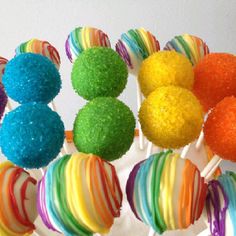 there are many colorful lollipops on the stick