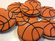 basketball cookies decorated with royal icing on a table