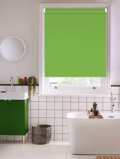 a bathroom with green shades on the window and white tile flooring, along with a bathtub