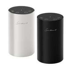 two black and white speakers sitting next to each other