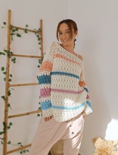 ✤ This wool sweater with dropped shoulders is pure softness and fluffiness, in addition to having cheerful colors without being too flashy. You can combine it in many different ways. ✤ I've crocheted this sweater using thick, premium acrylic wool that is completely hypoallergenic, ensuring it suits all types of skin, even the most sensitive. ✤ It's an incredibly comfortable sweater, long and slightly loose, with an openwork stitch, perfect for wearing a tank top or a dress underneath. The only part that isn't too loose is the sleeves they're not tight, but not as loose as the sweater itself. ✤ This chunky knit sweater has a boho style. This sweater is a size S/M. Nevertheless, here are its measurements so you can make sure of how it will fit you: - Length: 58 cm / 22,83 in - Width: 47 cm / Trendy White Knitted Sweater, White Chunky Knit Bohemian Sweater, Colorful Cozy Sweater For Spring, White Bohemian Chunky Knit Sweater, White Bohemian Knitted Sweater, White Bohemian Knit Sweater, Multicolor Knitted Sweater For Spring, Spring Multicolor Knitted Sweater, Casual Multicolor Crochet Knitting Pattern