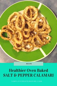 a green plate topped with onion rings on top of a table