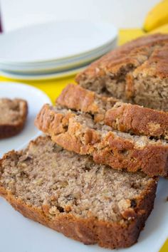 sliced banana bread sitting on top of a white plate