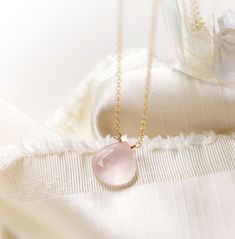 Natural Rose Quartz Teardrop Necklace - Sterling Silver or 14kt Gold Filled - Pale Pink Rose Quartz is a stone of love. It is believed to restore trust & harmony in relationships and encourage unconditional love. It purifies the heart and promotes self love, inner healing, and friendship. It is an alternate birthstone for January, as well as the spiritual birthstone for Taurus. This necklace is handcrafted with a natural, pale-colored Rose Quartz crystal. The stone is gem quality and therefore is more milky in coloring. Natural inclusions are present within each stone. The chain and clasp are available in sterling silver or 14kt gold fill. MATERIALS - Natural Rose Quartz - Stone Size: average 14mm (.62")  - Stone Shape: Faceted Heart Briolette - 14kt Gold Filled or Sterling Silver Chain & Crystal Photoshoot, Selenite Necklace, Rose Quartz Healing, Rose Quartz Jewelry, Photoshoot Idea, Pink Rose Quartz, Tourmaline Bracelet, Rose Quartz Pendant, Rose Quartz Necklace