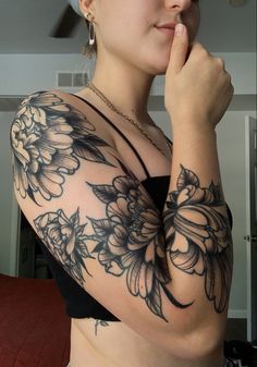 peony sleeve tattoo Peony Arm Sleeve Tattoo, Dark Floral Sleeve Tattoos For Women, Large Floral Cover Up Tattoo, Dark Floral Shoulder Tattoo, Matching Shoulder Tattoos For Women, Black Work Shoulder Tattoo, Large Peony Tattoo, Edgy Floral Tattoo, Shoulder Peony Tattoo