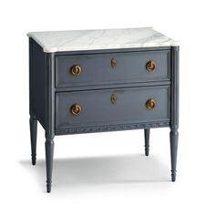 an old dresser with marble top and brass pulls on the drawers, against a white background