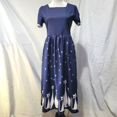 Please Read My Closet Info Listing Before Making An Offer Or A Bundle. Thanks! - Navy And White Retro Mod Kitty Cats And Stars Print Dress With High Square Neckline, Short Sleeves, And Full Skirt - New Without Tags - Back Zip Entry - Unlined - Tagged A Medium - 35% Polyester / 65% Cotton, No Stretch - Wash Dark Colors Separately - Bust 36", Waist 30" , Skirt Length 29.5", Total Length Center Back To Hem 47.5" Kitty Cats, Full Skirt, Star Print, Dark Colors, Square Neckline, Skirt Length, Navy And White, Print Dress, Colorful Dresses