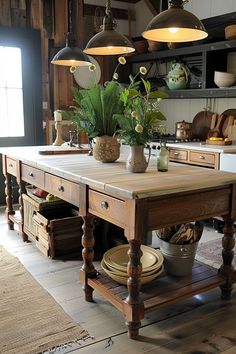 a kitchen island with pots and pans on it