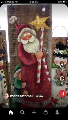 an image of santa holding a candy cane in front of christmas decorations and wooden boards