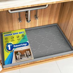 the under sink mat has been opened to reveal it's new design and packaging