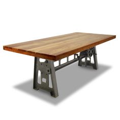 a wooden table sitting on top of a metal frame bench with wheels attached to it