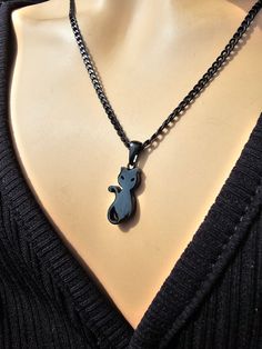 This is a blackened steel Gothic black cat kitty Pagan witchy Necklace that looks great alone or layered with others. Look at that cute kitty cat!! The minimalist design gives it a trendy and stylish feel, while the black steel gives it a touch of gothic Punk edge. This necklace runs approximately from 16 to 18 inches with a built-in extender.  This is a dainty chain, but is strong steel.. PLEASE NOTE FOR RETURNS! If I accept returns on your purchase (check when ordering, some items are "no retu Nickel-free Black Punk Necklaces, Black Nickel-free Punk Necklaces, Nickel-free Black Punk Necklace, Black Nickel-free Punk Necklace, Nickel-free Black Emo Jewelry, Halloween Black Cat Design Jewelry, Punk Style Black Necklace For Gift, Black Stainless Steel Jewelry With Lobster Clasp, Hypoallergenic Black Punk Jewelry