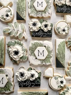 decorated cookies are arranged on a table