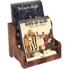 the kids are boogies album display in wooden stand with cd's on it